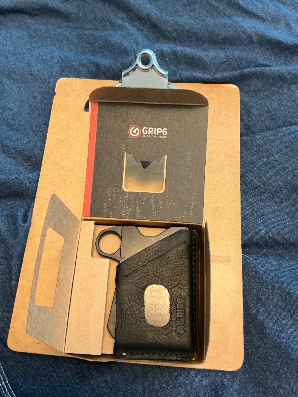 Grip6 RFID wallet with leather cover. New in box.